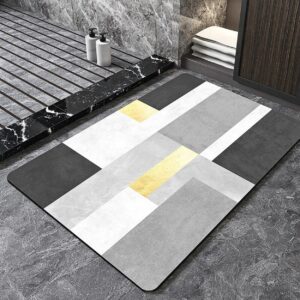 Ce tapis salle de bain avec motifs géométriques présente des motifs géométriques audacieux qui captent le regard et transforment l'espace