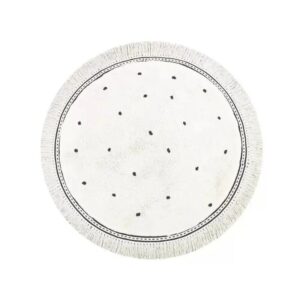 Tapis blanc rond à points. Design ludique et moderne, entretien facile et durabilité assurée. Idéal pour un intérieur chic et accueillant.