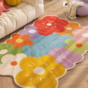 Un tapis de fleurs coloré en forme de grand assemblage de fleurs, chaque fleur ayant une couleur différente et vibrante.Le tapis est très doux et épais, idéal pour ajouter une touche de couleur et de confort à n'importe quel espace de vie. La composition et les couleurs vives du tapis en font un élément décoratif très joyeux et accueillant.